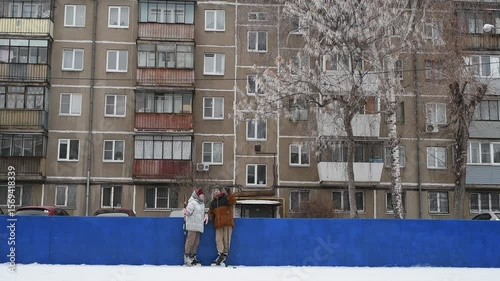 People skate and play ice hockey in the yard