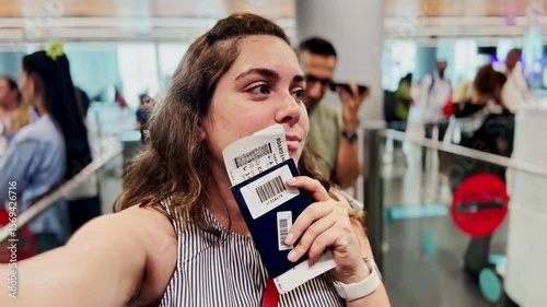 Happy Woman Takes Selfie with Passport at Airport Gate
