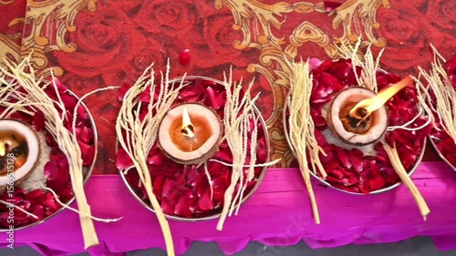 Traditional Festival Decoration with Lit Diyas and Petals on Ornamental Background