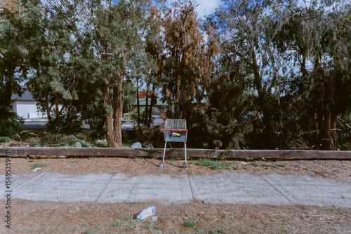 Trolley along street with rubbish