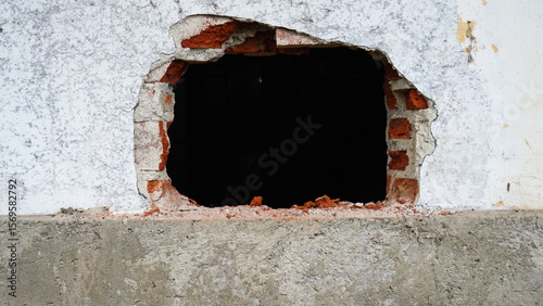 Closed Iron Door on Concrete Wall – Urban Texture and Industrial Detail