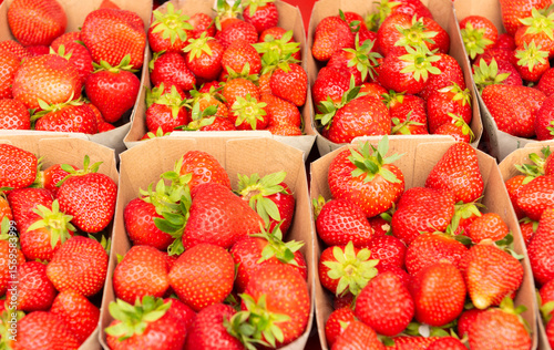 strawberries in eco-friendly paper boxes for sale.