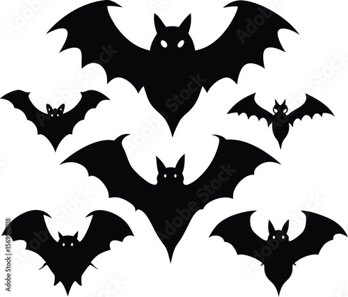 A group of black bat silhouettes flying in the dark
