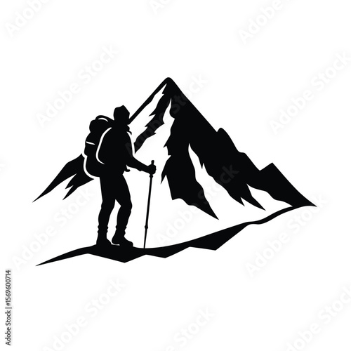 Silhouette of mountaineer with backpack and pole on snowy mountain