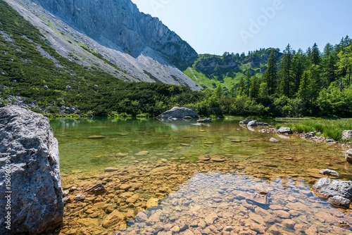 Принти на полотні Serene alpine lake with rocky shoreline