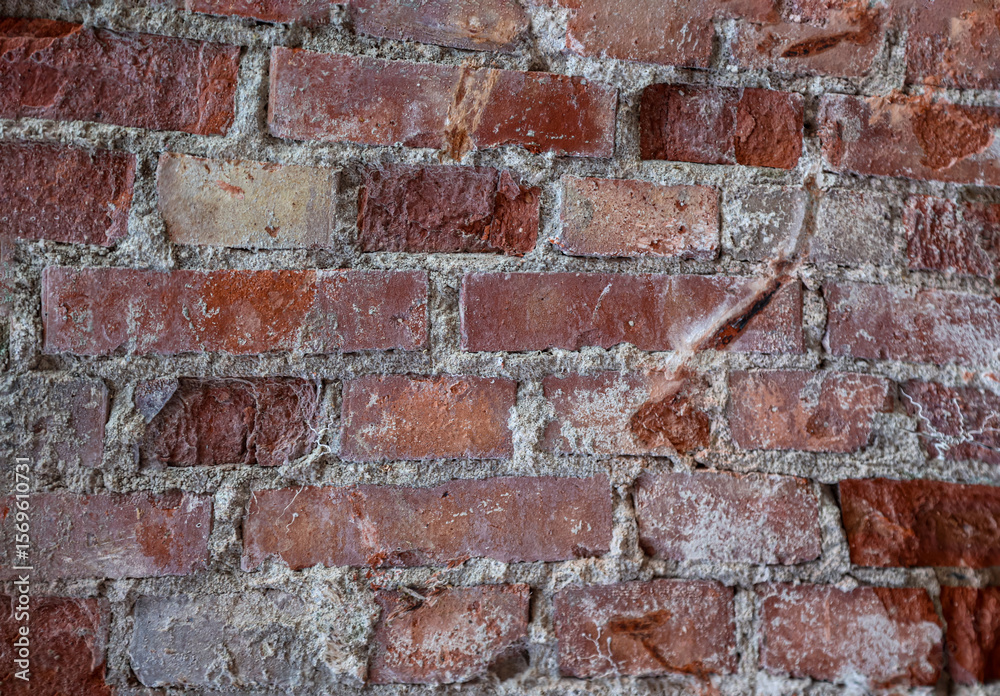 Fototapeta premium Eine Steintextur einer Backsteinmauer.