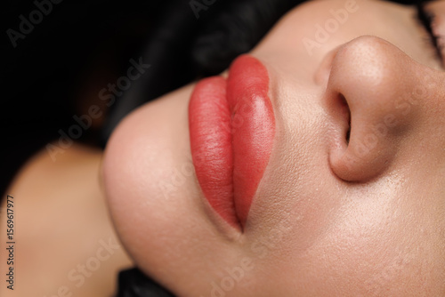 Macro photo showing subtle pink pigment and smooth texture from professional procedure.