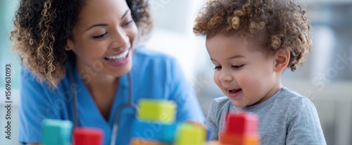 The joyful interaction between a caregiver and a child during playtime.