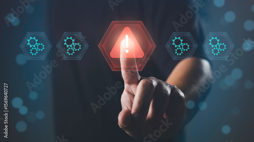 Photos Finger pointing at alert icon among system gears, representing issue detection, problem identification, system error, troubleshooting, and technical warning in digital operations