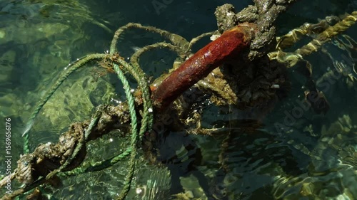Rope and Rusty Iron in Sea Water