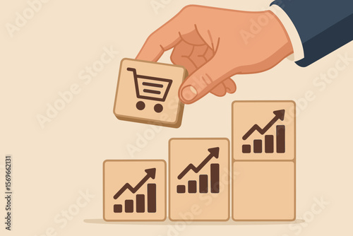 Businessman hand building a growing graph with a shopping cart block. Concept of sales volume increase, e-commerce, business growth, financial success, and marketing strategy.