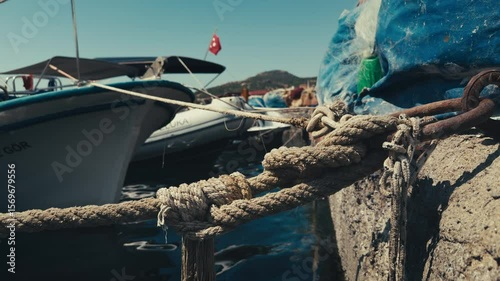 Rope Holding Fishing Boat in Dock