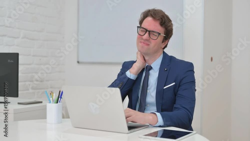 Neck Pain at Work for Mature Adult Businessman Typing on Laptop