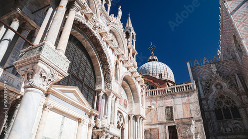 Stunning architectural details of St Marks Basilica in Venice on a clear day photo