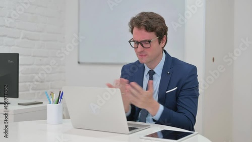 Mature Adult Businessman Reacting to Online Loss on Laptop