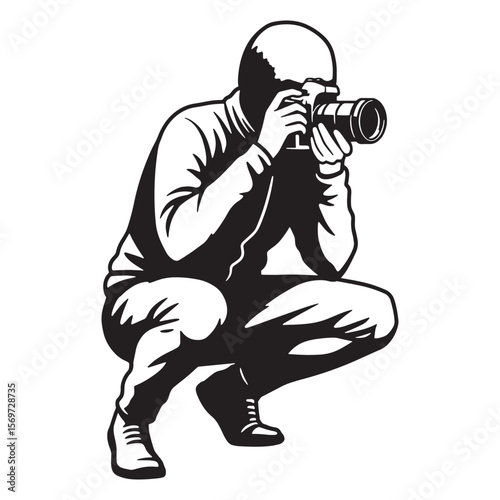 Black and white silhouette of a photographer crouching and taking a photo