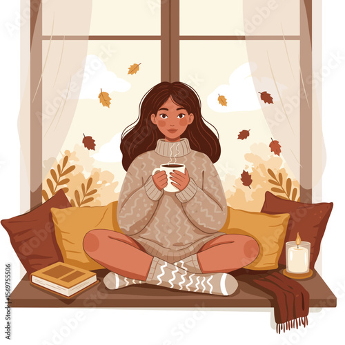 Young woman sitting on window seat, holding mug and relaxing indoors  