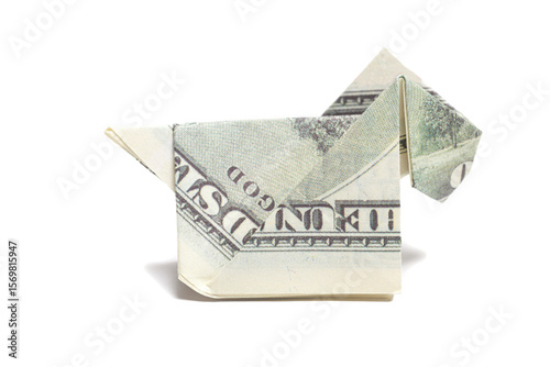 Origami dog made of one hundred dollar banknote on white background