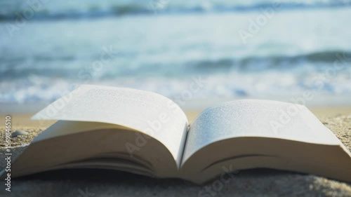open book on the sandy beach