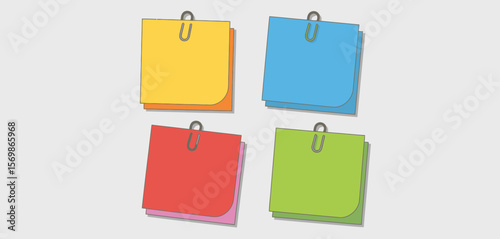 Four colorful sticky notes with paper clips attached against a neutral background