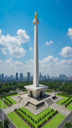 National Monument (Monas) in Jakarta, Indonesia with city skyline and blue sky