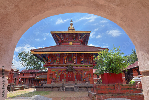 A majestic view of Changunarayan Temple, the oldest Hindu temple in Nepal, showcasing its traditional Newa architecture and rich cultural heritage through a beautifully framed arch.