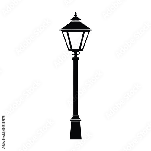 A vintage metal lamppost with an old street lamp illuminates the urban sky