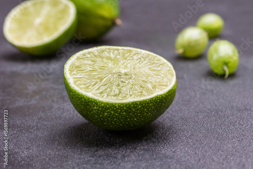 Lime halves on black background. Close up