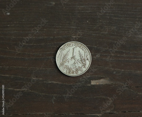 Coin half rupee on wooden table