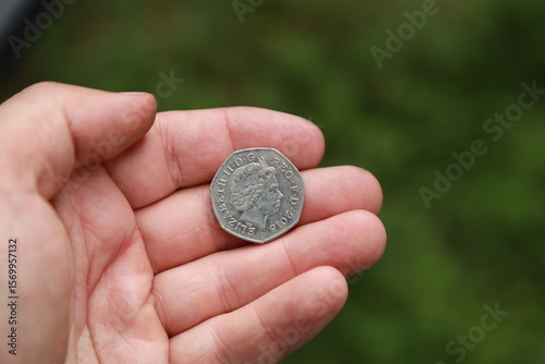 Coin of Great Britain in hand