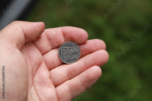 Coin of Great Britain in hand