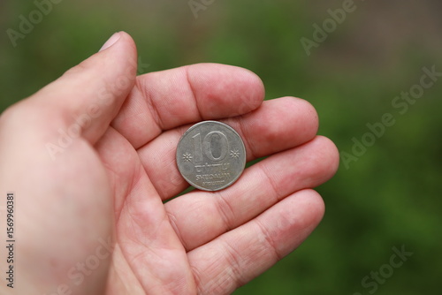 Israeli change coin on wooden table
