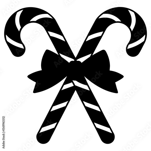 Two candy canes with a bow are isolated on white background