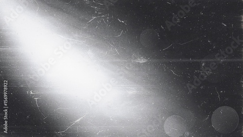 Light and shadow dance in a monochromatic ballet, a canvas of grunge with dust and scratches.