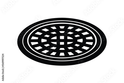 Circular metal manhole cover with a geometric grid pattern silhouette