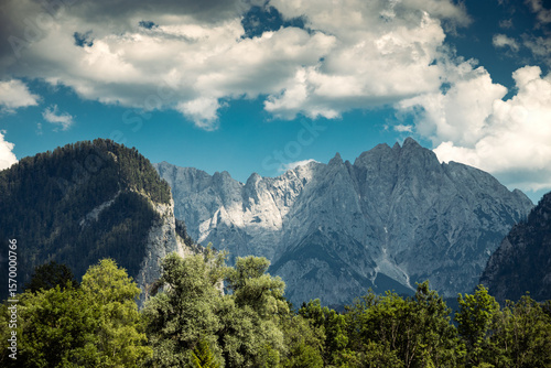Mountains panorama detail from Admont with dramatic clouds on sky and trees on foreground, Kreuzkogel, Riffel, Rosskopf, Kalbling mountains, Austria