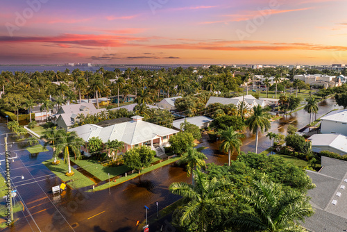 Papier peint Tropical rainstorm flooded residential homes in suburban community in Punta Gorda, Florida