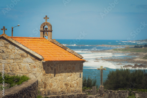 Old roadside chapel in the heart of Galicia, Spain, along the Portuguese Camino trail. Nestled on the scenic western coast of Europe