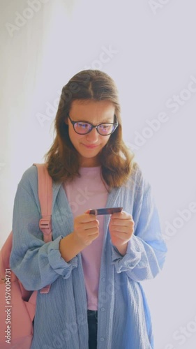 Young woman with glasses upset about money problems, ideal for authentic stories about academic challenges and budgeting