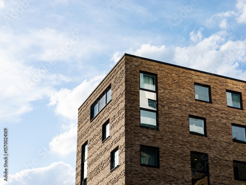 Photos Modern building facade with ochre-colored clinker bricks in a close-up