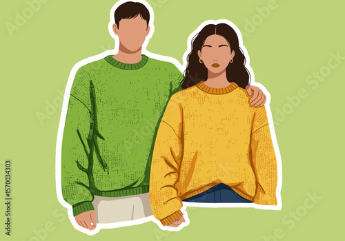Young couple wearing colorful sweaters on green background  