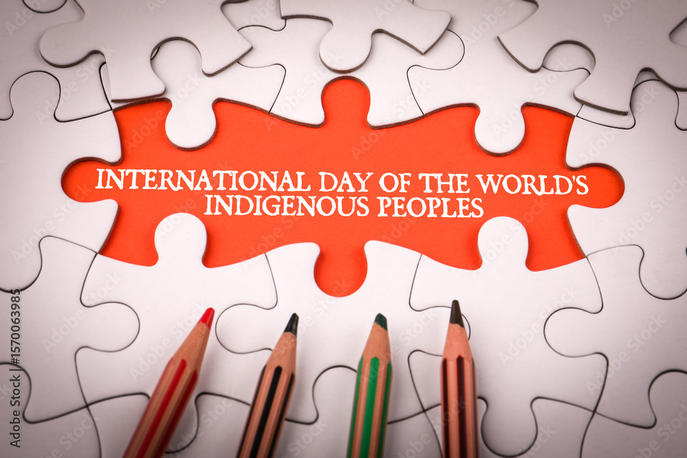 International Day of the World's Indigenous Peoples 9 August. White puzzle pieces and colored pencils International Day of the World's Indigenous Peoples 9 August. White puzzle pieces and colored pencils