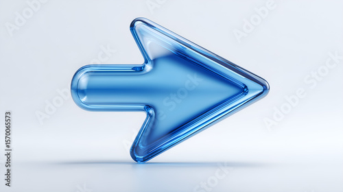 Direction in Focus: A polished, transparent, blue arrow pointing the way forward against a light-toned background, symbolizing progress and guidance.
