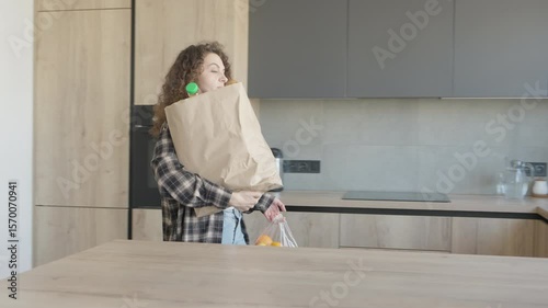 Wallpaper Mural Carrying Groceries Into Modern Kitchen With Full Paper And Plastic Bags Torontodigital.ca
