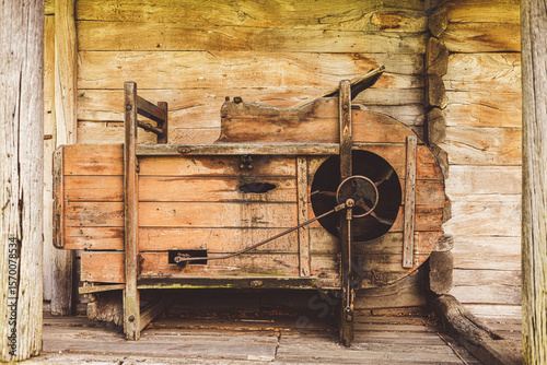 Φωτογραφία old wooden thresher for threshing grain