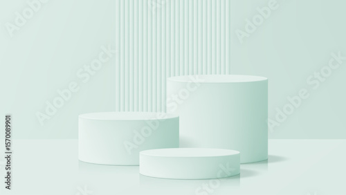 Three green cylindrical product display podiums with a ribbed wall in the background. Modern cosmetic or showcase pedestal for product presentation.