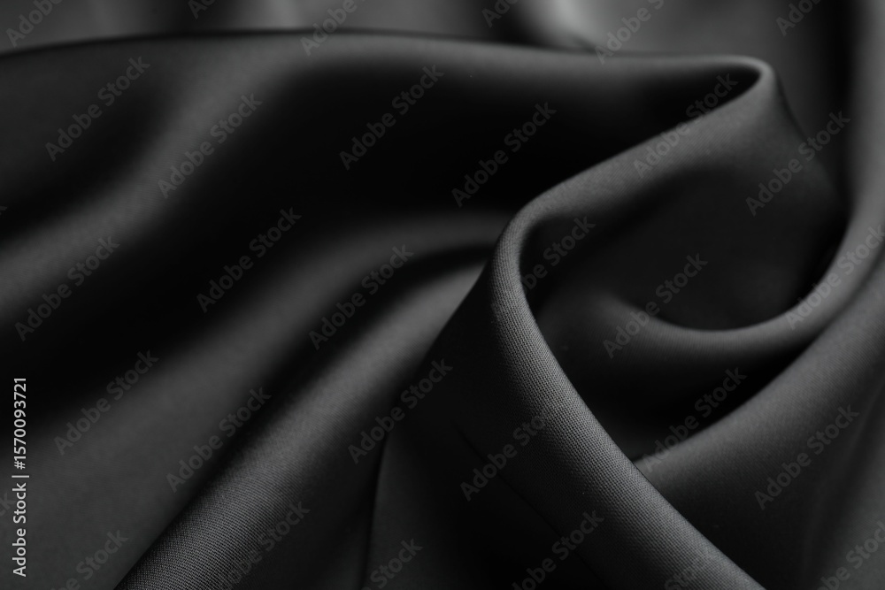 Obraz premium Crumpled black silk fabric as background, closeup
