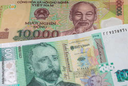 Wallpaper Mural 10000 Vietnamese dong and 100 Bulgarian lev banknotes. International trade concept Torontodigital.ca