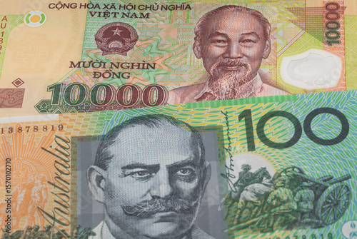 Wallpaper Mural 10000 Vietnamese dong and 100 Australian dollar banknotes. International trade concept Torontodigital.ca