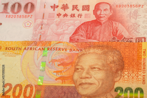 Wallpaper Mural 100 New Taiwan dollar and 200 South Africa rand banknotes. International trade concept Torontodigital.ca